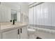 Cozy bathroom with shower-tub combination and white single sink vanity at 7916 Golden Pond Cir, Kissimmee, FL 34747