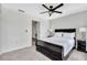 Bedroom with a large bed, ceiling fan, and carpeted flooring at 7916 Golden Pond Cir, Kissimmee, FL 34747