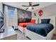 Colorful bedroom with Spiderman themed wall decor and two beds at 7916 Golden Pond Cir, Kissimmee, FL 34747