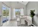 Bright dining nook features bench seating, natural light, and views of the pool area through sliding glass doors at 7916 Golden Pond Cir, Kissimmee, FL 34747