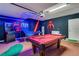 Garage featuring a pool table, an arcade game and Star Wars themed decor, perfect for entertainment at 7916 Golden Pond Cir, Kissimmee, FL 34747