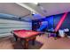 Garage featuring a pool table, an arcade game and Star Wars themed decor, perfect for entertainment at 7916 Golden Pond Cir, Kissimmee, FL 34747