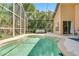 Enclosed pool with a spacious deck, offering a tranquil spot to unwind with comfortable seating and clear blue water at 7916 Golden Pond Cir, Kissimmee, FL 34747