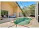 Stunning pool area and patio with hot tub, ideal for entertaining or relaxing in a private, screened outdoor space at 7916 Golden Pond Cir, Kissimmee, FL 34747