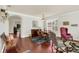 Elegant dining room featuring hardwood floors and stylish furniture at 8044 Saint James Way, Mount Dora, FL 32757