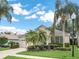 Single-story home with landscaped front yard, a two-car garage, and a bright sky at 8044 Saint James Way, Mount Dora, FL 32757