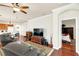 Open-concept living room connecting to the kitchen and bedroom, creating a cohesive and functional space at 8044 Saint James Way, Mount Dora, FL 32757