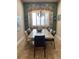 Elegant dining room with large window, custom valance, and built-in seating for Gathering meals at 8908 Via Bella Notte, Orlando, FL 32836