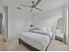 Bright bedroom with ceiling fan, comfortable bed, and neutral-toned walls at 945 N Fern Creek Ave, Orlando, FL 32803