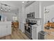 Well-designed kitchen featuring stainless steel appliances, white cabinets, and breakfast bar at 945 N Fern Creek Ave, Orlando, FL 32803