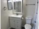 Bathroom featuring a single sink vanity, commode and shower/tub combination at 1002 Stucki Ter, Winter Garden, FL 34787