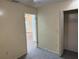 View of the bedroom, looking through the doorway, and into the closet with wire shelving at 1002 Stucki Ter, Winter Garden, FL 34787