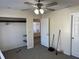 This bedroom features a ceiling fan, tiled floors, and a small closet at 1002 Stucki Ter, Winter Garden, FL 34787