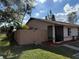 A single-story home featuring a fenced yard and a screened in front porch at 1002 Stucki Ter, Winter Garden, FL 34787