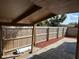 Covered patio area fenced with a wooden fence perfect for outdoor dining and entertaining at 1002 Stucki Ter, Winter Garden, FL 34787