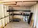 The interior of a shed with shelving, offering organized storage solutions for tools and equipment at 1002 Stucki Ter, Winter Garden, FL 34787