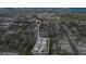 Aerial view highlighting homes in relation to the city, lake, commercial buildings, roads, and landmarks at 11 W Harding St # D, Orlando, FL 32806