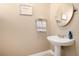 Powder room featuring a white pedestal sink and modern fixtures at 11 W Harding St # D, Orlando, FL 32806