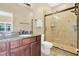 Bathroom with granite countertop vanity and a glass door shower at 11 W Harding St # D, Orlando, FL 32806