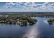 Stunning aerial view showcasing the home's lakefront location and proximity to the city skyline at 1100 S Lake Sybelia Dr, Maitland, FL 32751