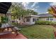 Backyard view showing patio, picnic table, and landscaped lawn at 1100 S Lake Sybelia Dr, Maitland, FL 32751