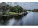 Aerial view of the house's waterfront featuring a boat dock at 1100 S Lake Sybelia Dr, Maitland, FL 32751