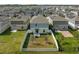 Aerial view of fenced in yard with patio set, barbecue grill, and well-kept lawn at 1139 James Paul Rd, Davenport, FL 33837