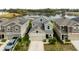 Aerial view of home featuring 2-car garage, well-kept lawn, and solar panels at 1139 James Paul Rd, Davenport, FL 33837