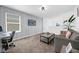 Bright living room featuring modern decor, plush sofa, and view from the second floor at 1139 James Paul Rd, Davenport, FL 33837