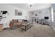 Cozy living room with stylish furnishings, neutral carpet, and a well-lit workspace at 1139 James Paul Rd, Davenport, FL 33837