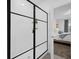 Modern shower featuring glass enclosure and door, white tile, and black accents at 1139 James Paul Rd, Davenport, FL 33837