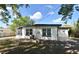 Back exterior view of home with screened porch, yard and new AC system at 117 Shannon Dr, Sanford, FL 32773