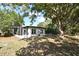 Back exterior view of home with screened porch and spacious back yard at 117 Shannon Dr, Sanford, FL 32773