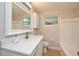 Bathroom featuring a white vanity with quartz countertop, white cabinets, and a shower-tub combo at 117 Shannon Dr, Sanford, FL 32773