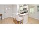 Bright kitchen with a quartz island and white cabinets, perfect for gatherings and meal preparation at 117 Shannon Dr, Sanford, FL 32773