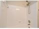 Bright shower tub combo with white tiled walls and shower head at 117 Shannon Dr, Sanford, FL 32773