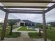 Backyard with covered pergola and great view at 12625 Sweet Hill Rd, Polk City, FL 33868