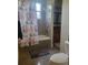 Bathroom featuring tile floors, a shower/tub combo with a decorative curtain, and a wood vanity at 12625 Sweet Hill Rd, Polk City, FL 33868