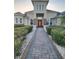 Elegant home exterior showcasing manicured landscaping and an inviting entryway at 12625 Sweet Hill Rd, Polk City, FL 33868