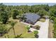 Sweeping aerial view showing a lovely home with large yard and long driveway at 1303 Sultan Cir, Chuluota, FL 32766