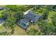 Aerial shot highlighting the screened-in pool area and well-maintained landscaping of the home at 1303 Sultan Cir, Chuluota, FL 32766