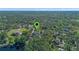 Aerial view with map pin showcasing lush, green surroundings at 1303 Sultan Cir, Chuluota, FL 32766