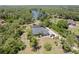 Lush aerial view of a beautiful property by the lake at 1303 Sultan Cir, Chuluota, FL 32766