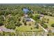 Spacious aerial view featuring a sprawling property near a serene lake at 1303 Sultan Cir, Chuluota, FL 32766