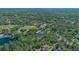 Aerial view showing lush, green surroundings near a lake at 1303 Sultan Cir, Chuluota, FL 32766