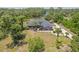 Desirable property featuring a beautiful home with a long driveway and mature palm trees at 1303 Sultan Cir, Chuluota, FL 32766