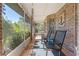 Inviting screened patio with comfortable seating and views of lush greenery at 1303 Sultan Cir, Chuluota, FL 32766