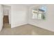 Neutral bedroom with tile floors, a large window, and stairway access at 13169 Bromborough Dr, Orlando, FL 32832