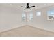 Sunlit bedroom featuring neutral carpeting, recessed lighting, and several windows at 13169 Bromborough Dr, Orlando, FL 32832