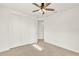 Bedroom with neutral carpet, a ceiling fan, closet, and access to other rooms at 13169 Bromborough Dr, Orlando, FL 32832